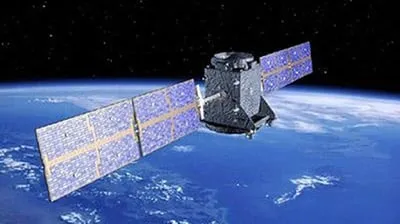 Navigation satellite with solar panels deployed in orbit above Earth